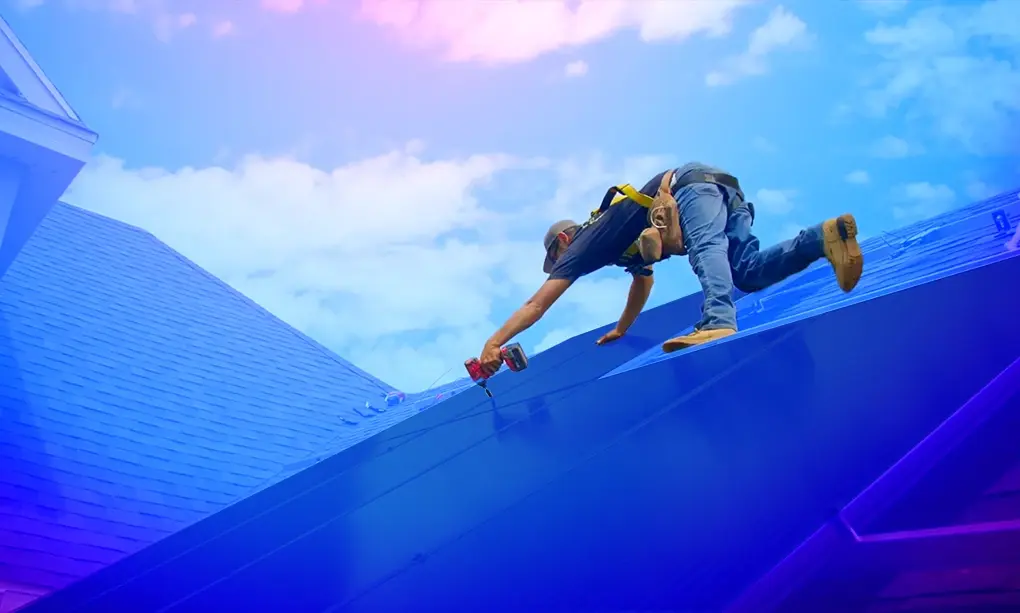 Solar panel installer securing panels to a roof